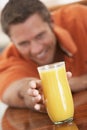 Middle Aged Man Drinking Fresh Orange Juice Royalty Free Stock Photo