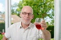 Middle-aged man drinking a glass of wine Royalty Free Stock Photo