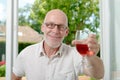 Middle-aged man drinking a glass of wine Royalty Free Stock Photo