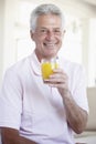 Middle Aged Man Drinking Orange Juice Royalty Free Stock Photo