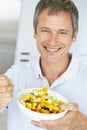 Middle Aged Man Eating Fresh Fruit Salad Royalty Free Stock Photo