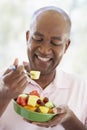 Middle Aged Man Eating Fresh Fruit Salad Royalty Free Stock Photo