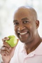 Middle Aged Man Eating Green Apple Royalty Free Stock Photo