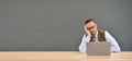 Middle-aged man getting bored in front of laptop Royalty Free Stock Photo