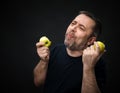 Middle-aged man with a green apples Royalty Free Stock Photo