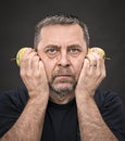 Middle-aged man with a green apples Royalty Free Stock Photo