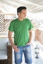 Middle Aged Man With Green T-Shirt Standing Outdoors Royalty Free Stock Photo