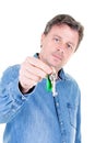 Middle aged man hand over keys with empty white background Royalty Free Stock Photo