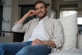 Middle-aged man having a restful moment relaxing in sofa.