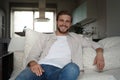 Middle-aged man having a restful moment relaxing in sofa.