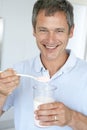 Middle Aged Man Holding Dietary Supplements