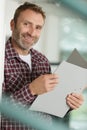 middle-aged man holding ringbinder file Royalty Free Stock Photo