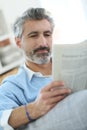 Middle-aged man reading newspaper Royalty Free Stock Photo
