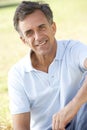 Middle Aged Man Relaxing In Countryside Royalty Free Stock Photo