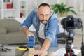 Middle aged man sanding wood Royalty Free Stock Photo