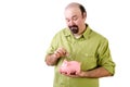 Middle aged man saving money in piggy bank