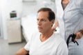 Middle aged man sitting in wheelchair at hospital room Royalty Free Stock Photo