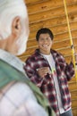 Middle-aged man and son on fishing trip Royalty Free Stock Photo