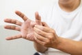 Middle-aged man suffering from De quervain`s disease,numbness or beriberi of palms and fingertips,male patient with trigger finge