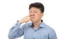 A middle-aged man suffering from rhinitis on white background