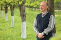 Middle-aged man in summer garden