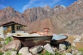 Middle-aged man taking a bath outdoors