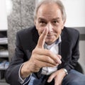 Middle-aged man threatens his finger Royalty Free Stock Photo