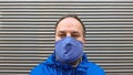 Middle aged man wearing cloth face mask or community mask during corona covid-19 pandemic