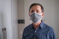Middle-aged man wears face mask in the Coronavirus Covid19 pandemic