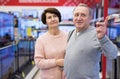 Middle aged man and woman choosing TV in electronic store Royalty Free Stock Photo