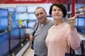 Middle aged man and woman choosing TV in electronic store Royalty Free Stock Photo