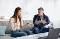 Middle aged married couple calculating expenses, suffering from economic crisis at home. Family budget concept Royalty Free Stock Photo