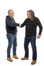 Middle-aged men shake hand, full length.  Isolated on a white background. Royalty Free Stock Photo