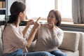 Middle aged mother and adult daughter speaking sign language Royalty Free Stock Photo