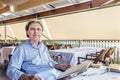 Middle-aged soft skin man looking at menu in restaurant