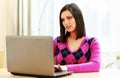Middle-aged thoughtful woman using laptop Royalty Free Stock Photo