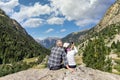 Middle aged tourist couple take a picture with mobile phone in Pyrenees mountain, Saint Maurici and Augestortes, Spain