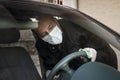 Senior Turkish man disinfects his car Royalty Free Stock Photo