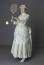 A Victorian Woman Wearing A Tennis Ensemble And A Straw Boater