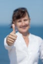 Middle aged woman showing thumb up Royalty Free Stock Photo