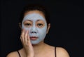 A middle-aged woman Asians are happy with a face mask for skin c Royalty Free Stock Photo