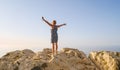 Middle-aged woman in blue dress greets the sun dawn Royalty Free Stock Photo