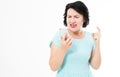 Middle aged woman in blue dress using smartphone stressed, shocked with shame and surprise face, angry and frustrated