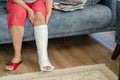 The middle aged woman with broken leg at home