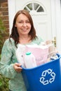 Middle Aged Woman Carrying Recycling Bin Royalty Free Stock Photo