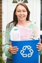 Middle Aged Woman Carrying Recycling Bin Royalty Free Stock Photo