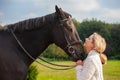 Middle Aged Woman Close With Her Horse Royalty Free Stock Photo