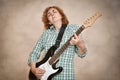 Middle aged woman playing electric guitar Royalty Free Stock Photo