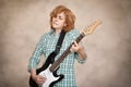 Middle aged woman playing electric guitar Royalty Free Stock Photo