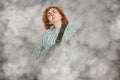 Woman with closed eyes playing electric guitar Royalty Free Stock Photo